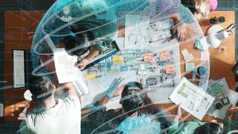 Top,Down,Aerial,View,Of,Civil,Engineer,Team,Holding,Blueprint